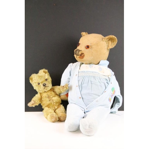 315 - Two early to mid 20th century teddy bears, one being golden mohair and the larger with straw filled ... 