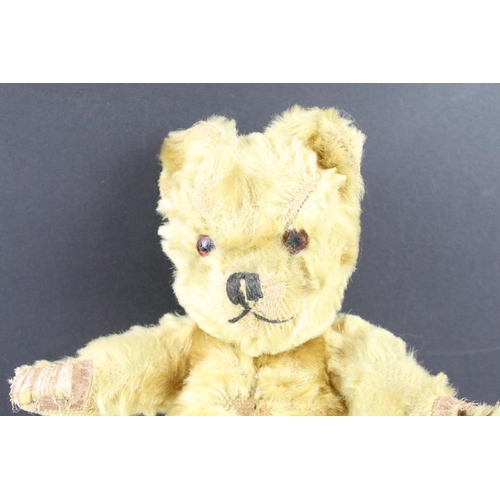 315 - Two early to mid 20th century teddy bears, one being golden mohair and the larger with straw filled ... 