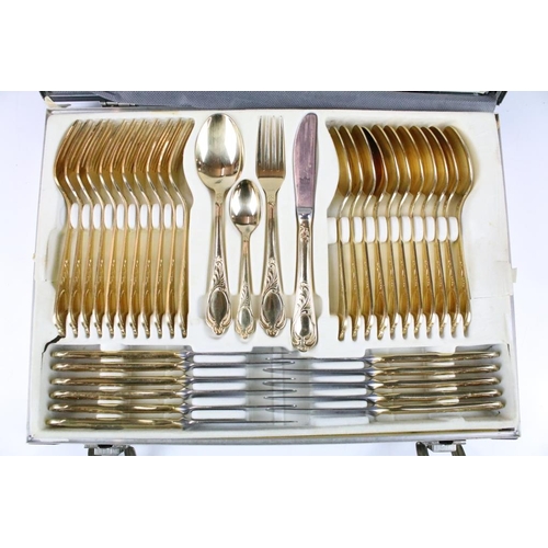 320 - Solingen German gold plated cutlery canteen for twelve, each having moulded details to the handles a... 