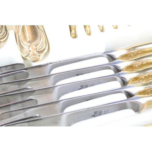 320 - Solingen German gold plated cutlery canteen for twelve, each having moulded details to the handles a... 