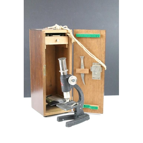 345 - C Baker London electric microscope together with a desk top mirror microscope set within a wooden ca... 