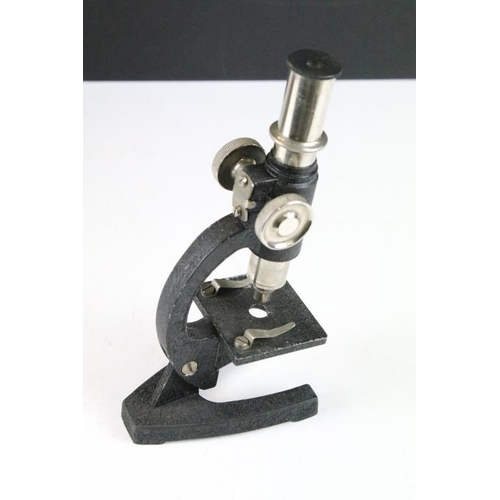 345 - C Baker London electric microscope together with a desk top mirror microscope set within a wooden ca... 