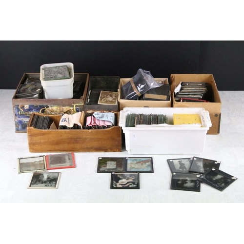 588 - Collection of magic lantern slides across six small boxes. The lot to include topographical, British... 