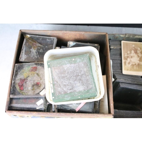 588 - Collection of magic lantern slides across six small boxes. The lot to include topographical, British... 