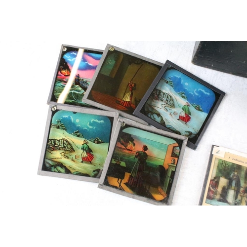 592 - A large collection of approx 200 x coloured glass magic lantern slides to include Alice in Wonderlan... 