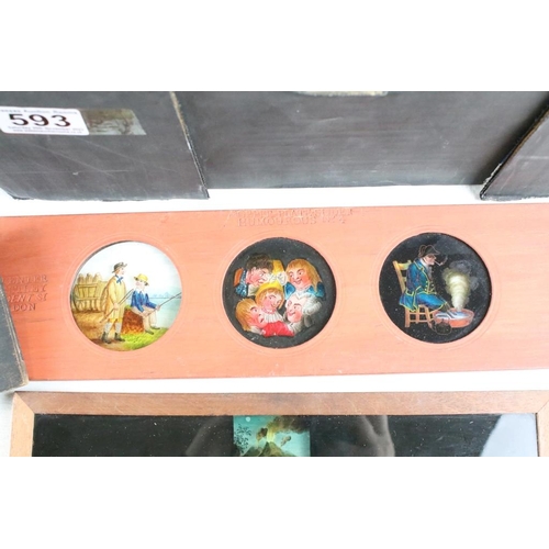 593 - A large collection of wooden framed coloured glass magi lantern slides to include Birds, Animals, Nu... 