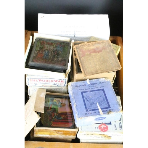 594 - A large collection of over 300 x coloured glass magic lantern slides to include Peter Pan, The World... 