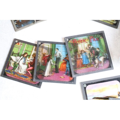 594 - A large collection of over 300 x coloured glass magic lantern slides to include Peter Pan, The World... 