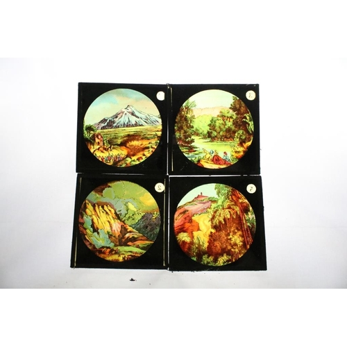 594 - A large collection of over 300 x coloured glass magic lantern slides to include Peter Pan, The World... 