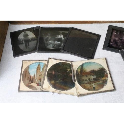 599 - A collection of over 100 magic lantern glass slides to include topographical & architectural example... 