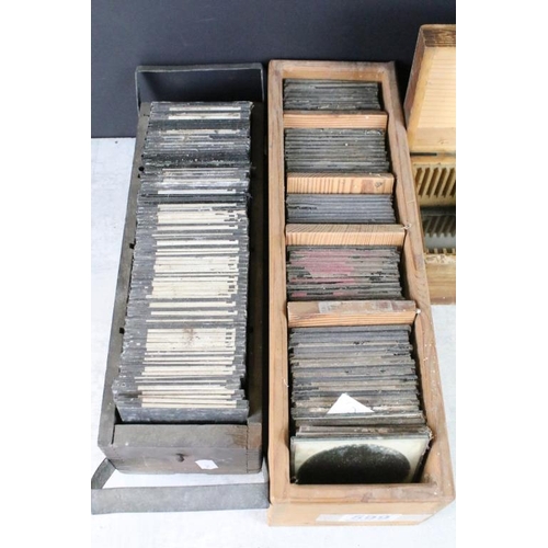 599 - A collection of over 100 magic lantern glass slides to include topographical & architectural example... 