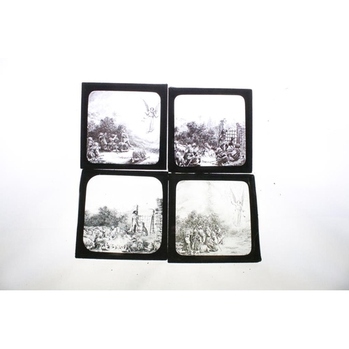 603 - A collection of over 100 glass magic lantern slides contained within three wooden boxes, mainly reli... 