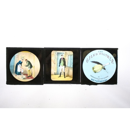 603 - A collection of over 100 glass magic lantern slides contained within three wooden boxes, mainly reli... 