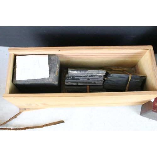 603 - A collection of over 100 glass magic lantern slides contained within three wooden boxes, mainly reli... 