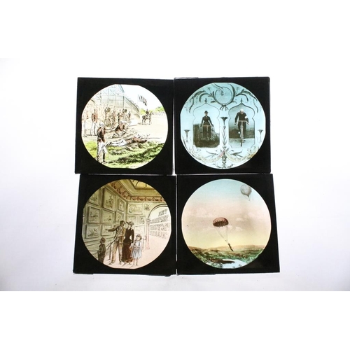 604 - A collection of over 100 glass magic lantern slides contained within three wooden boxes to include W... 