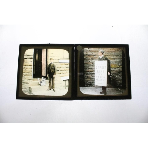 605 - A collection of over 100 glass magic lantern slides contained within three wooden boxes to include A... 