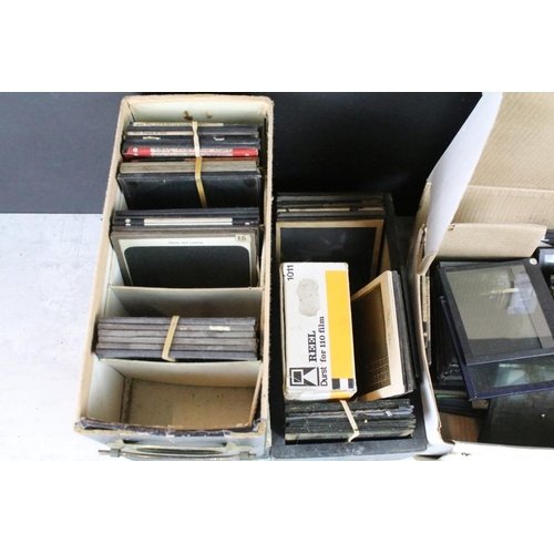 606 - A collection of approx 100 x glass magic lantern slide within three boxes to include Animals, Boats ... 