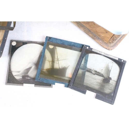 609 - Three small boxes of magic lantern slides to include portraits of Queen Victoria, the wreck of hespe... 