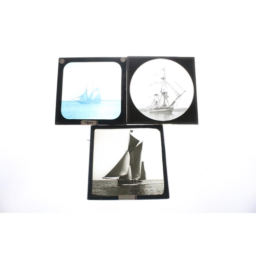 609 - Three small boxes of magic lantern slides to include portraits of Queen Victoria, the wreck of hespe... 