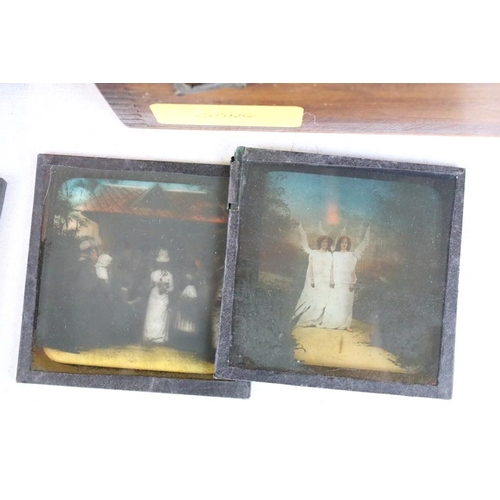 614 - Three boxes of magic lantern slides to include Biblical and from life model stories including the ro... 