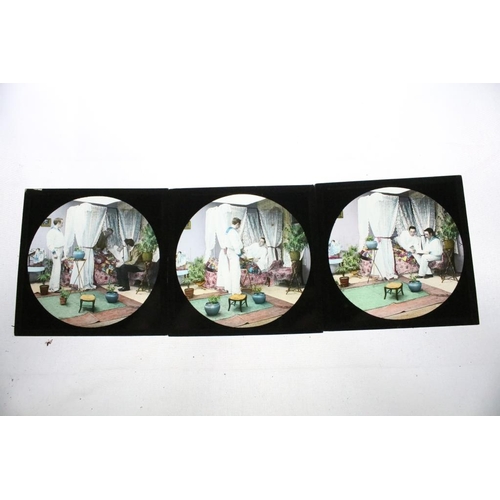 622 - A collection of approx 150 x glass magic lantern slides contained within three wooden cases to inclu... 