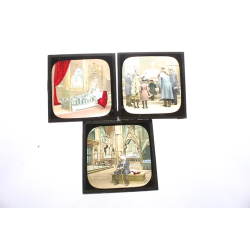 622 - A collection of approx 150 x glass magic lantern slides contained within three wooden cases to inclu... 