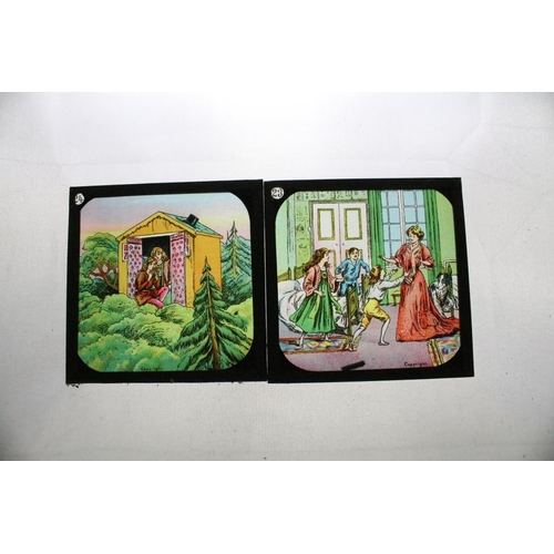 623 - A collection of approx 100 x glass magic lantern slides contained within three wooden cases to inclu... 