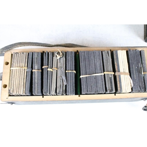 624 - A collection of approx 100 x glass magic lantern slides contained within three wooden cases to inclu... 