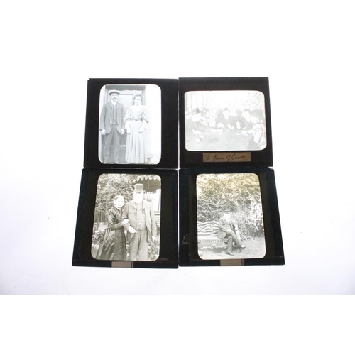 625 - A collection of approx 100 x glass magic lantern slides contained within three wooden cases to inclu... 