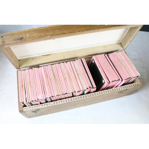 626 - A collection of over 100 x glass magic lantern slides contained within three wooden cases to include... 