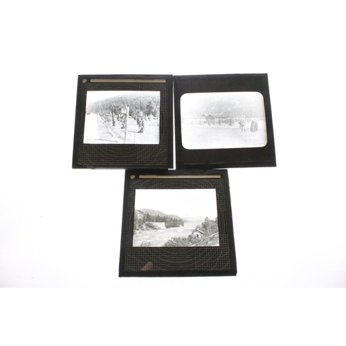 626 - A collection of over 100 x glass magic lantern slides contained within three wooden cases to include... 