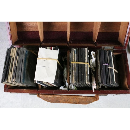 635 - A collection of over 100 glass magic lantern slides contained within four wooden cases to include Ro... 