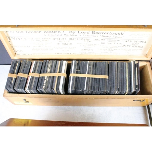 635 - A collection of over 100 glass magic lantern slides contained within four wooden cases to include Ro... 