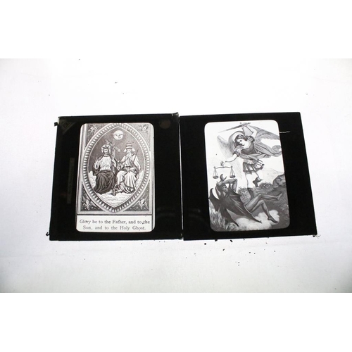 636 - A collection of over 100 mixed glass magic lantern slides contained within four wooden cases to incl... 