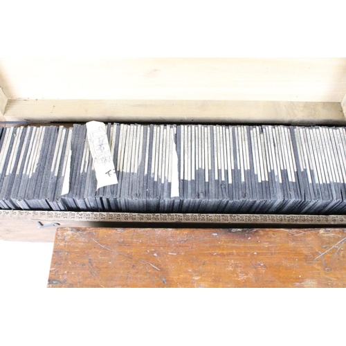 636 - A collection of over 100 mixed glass magic lantern slides contained within four wooden cases to incl... 