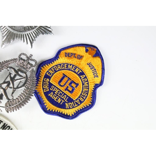 199 - A collection of mixed Police badges to include helmet badges from various British constabilaries and... 