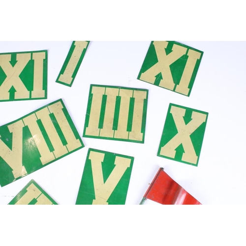 200 - A collection of tin plate Roman numeral markers together with a red tin plate flag.