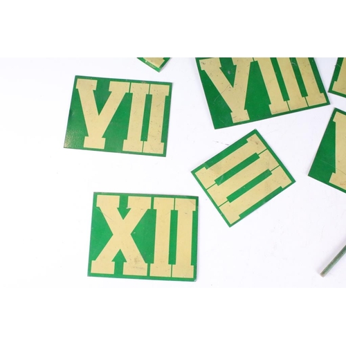 200 - A collection of tin plate Roman numeral markers together with a red tin plate flag.