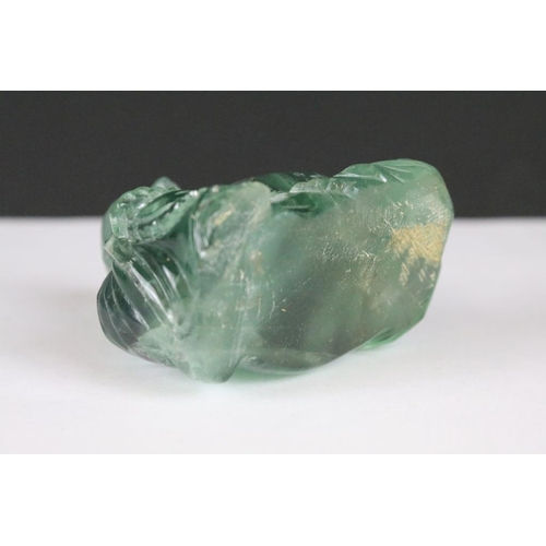 201 - A hand craved fluorite ornamental buddha, stands approx 7cm in height.