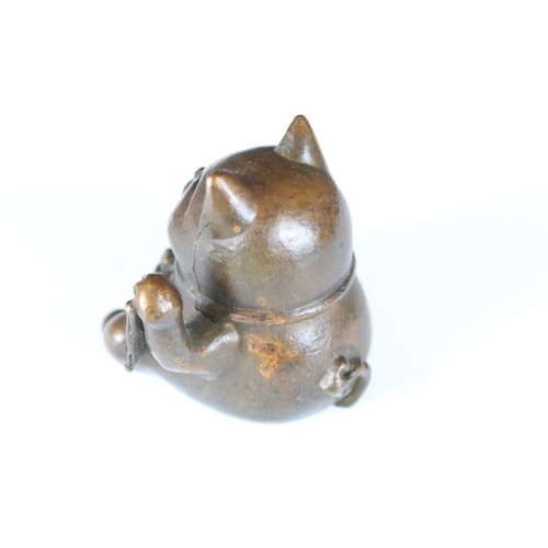 203 - An ornamental Japanese bronze 招き猫 / maneki-neko (waving / beckoning) lucky cat talisman.