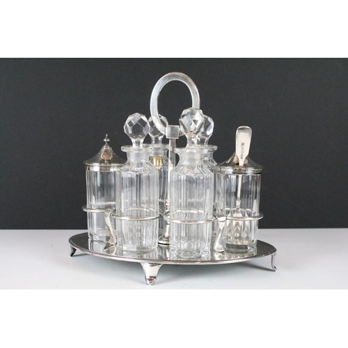 212 - A cut glass and silver plate six piece condiment set.