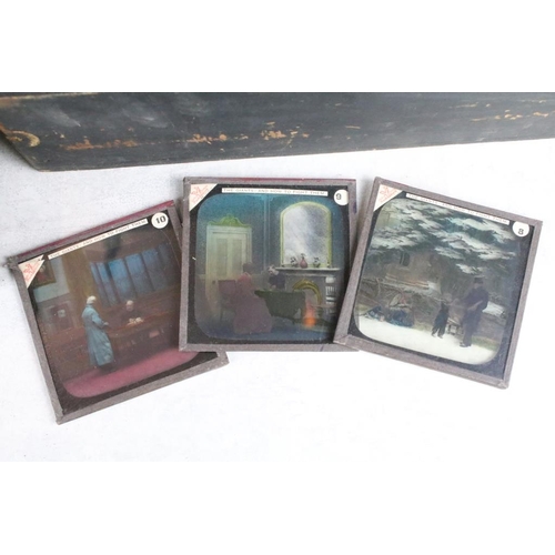 637 - A collection of over 100 glass magic lantern slides contained within four wooden cases to include Re... 