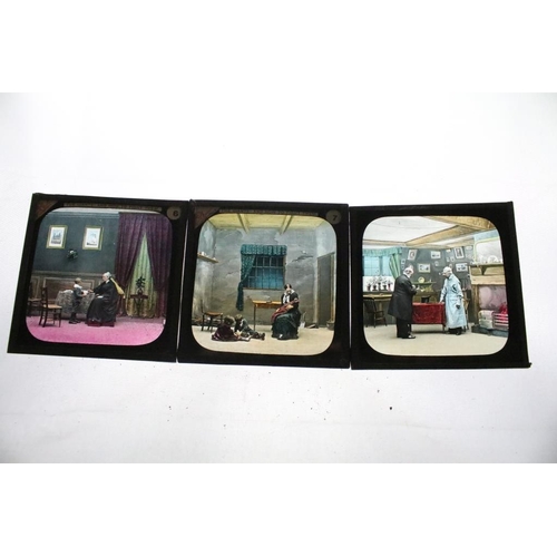 637 - A collection of over 100 glass magic lantern slides contained within four wooden cases to include Re... 