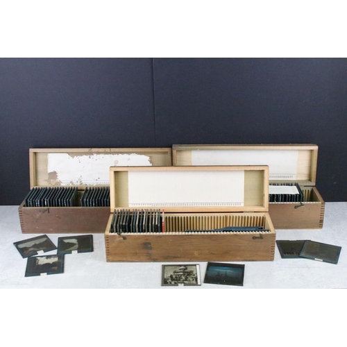 638 - A collection of approx 100 glass magic lantern slides contained within three boxes to include nautic... 