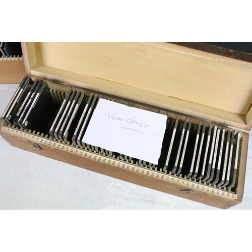 640 - A collection of approx 50 glass magic lantern slides contained within two wooden cases, all topograp... 