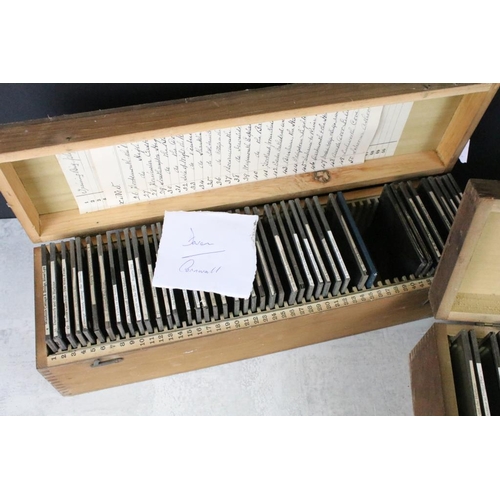 640 - A collection of approx 50 glass magic lantern slides contained within two wooden cases, all topograp... 