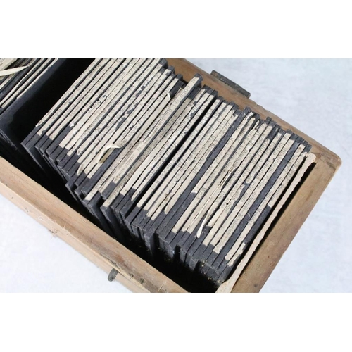 643 - A collection of approx 50 glass magic lantern slides contained within a wooden case to include Lifeb... 