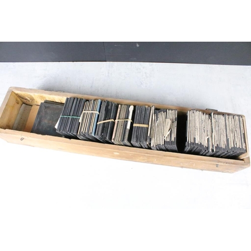 643 - A collection of approx 50 glass magic lantern slides contained within a wooden case to include Lifeb... 