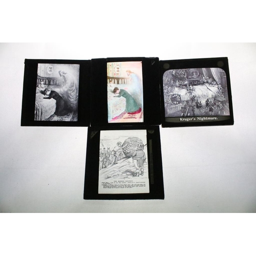 646 - A collection of over 100 glass magic lantern slides contained within three wooden cases to include T... 