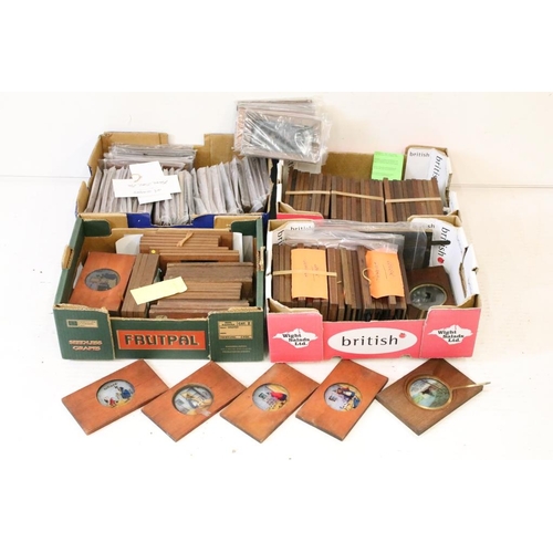 649 - A large collection of wooden framed coloured magic lantern slides to include lever action examples, ... 